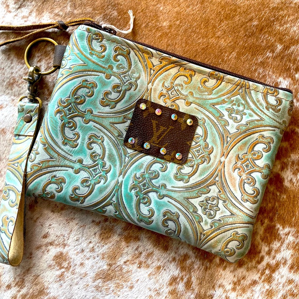 Tooled leather wristlet with Authentic LV flare.